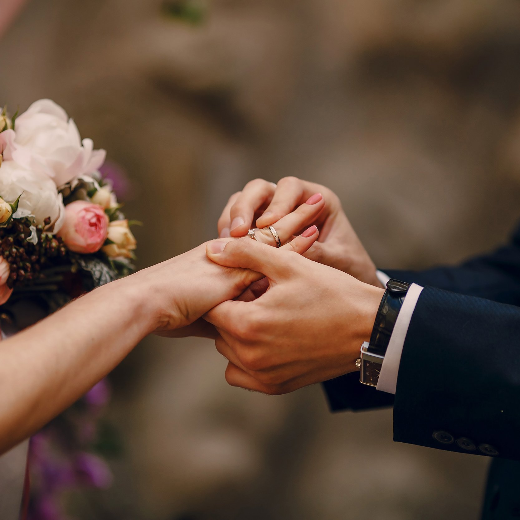 groom-putting-ring-bride-s-finger